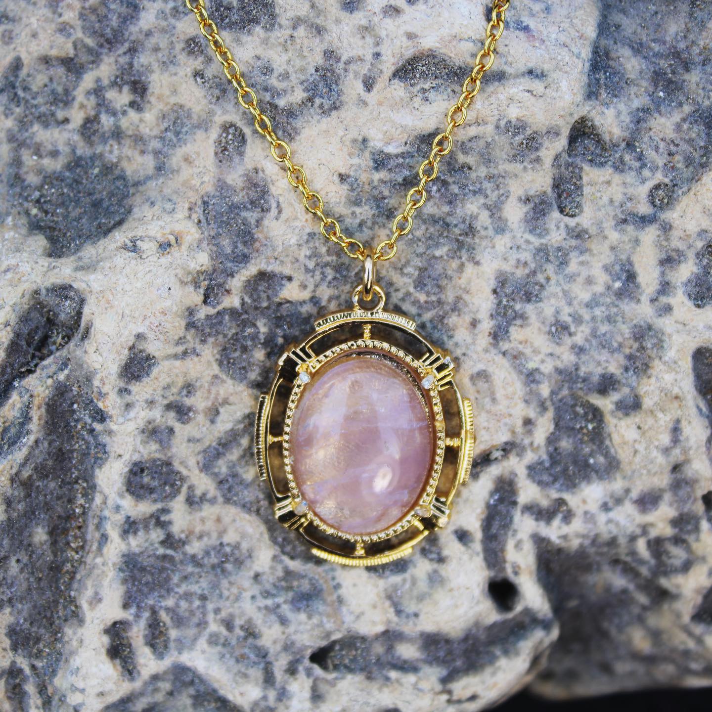 Necklace with natural Amethyst, delicate purple, hand cut to a 20x15mm oval cabochon and set in a gold plated setting with 19 inch chain.