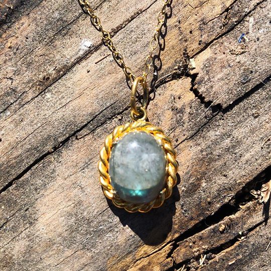 Necklace with a scintilating blue-flash Labradorite, hand polished to a 12x9mm cabochon and set in 14 carat gold filled setting with an 18 inch, 14 carat gold filled chain.